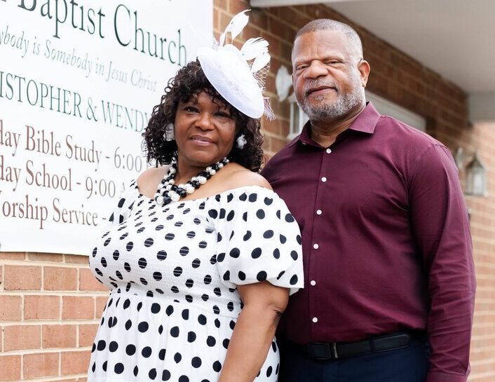 chris and wendy cooper outside pilgrim baptist church